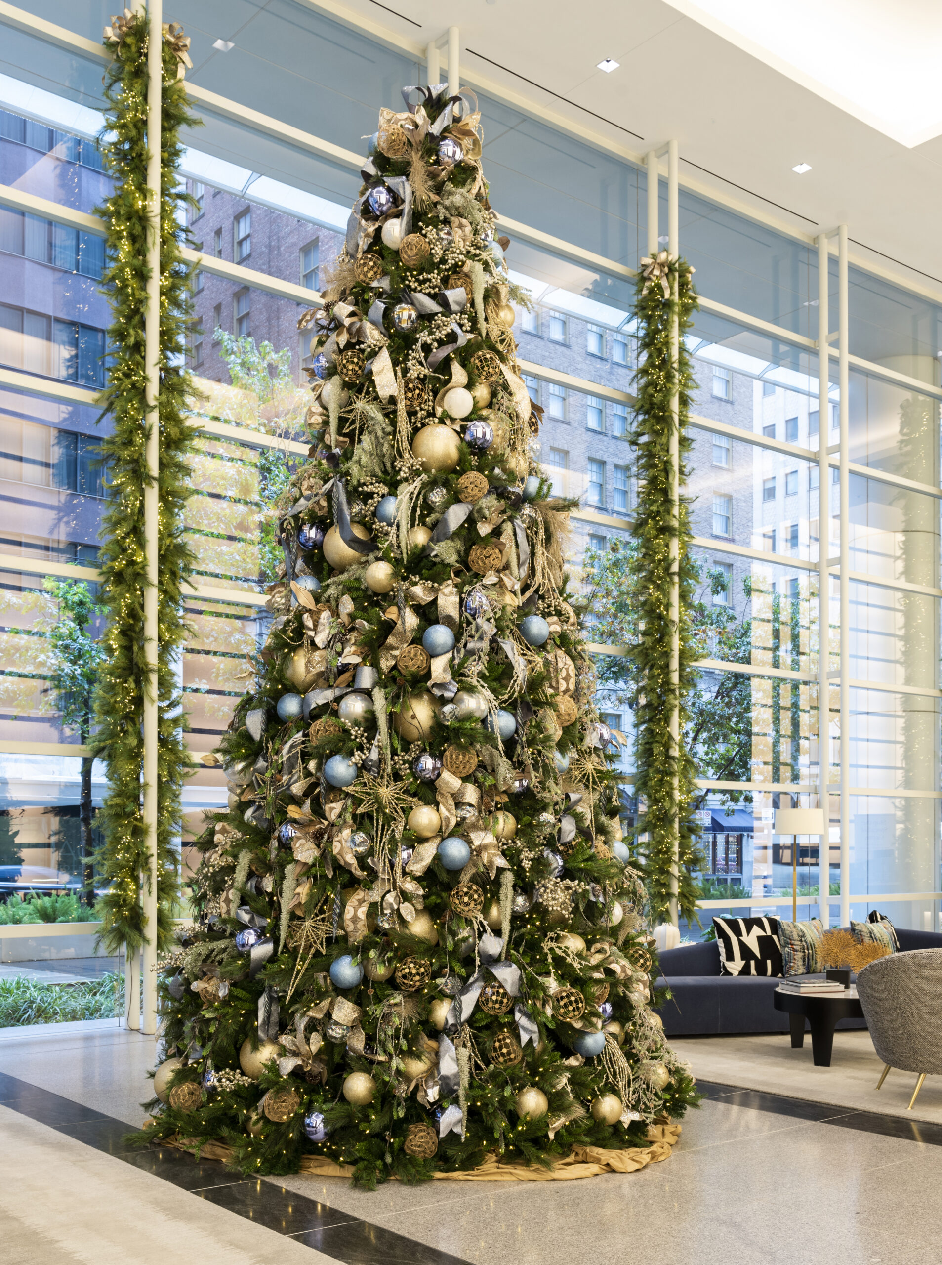 Professionally decorated Christmas Tree and Garland in Corporate Lobby