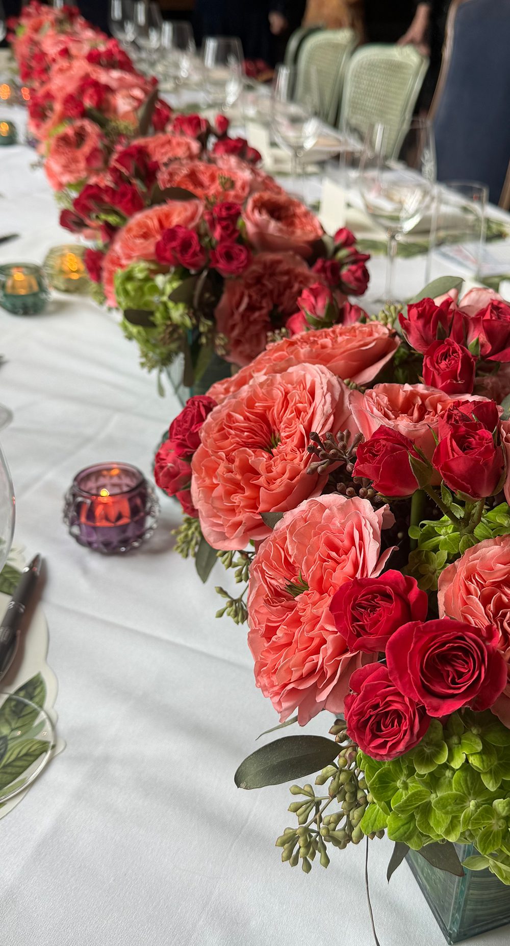 Long Table with Red floral centerpieces.